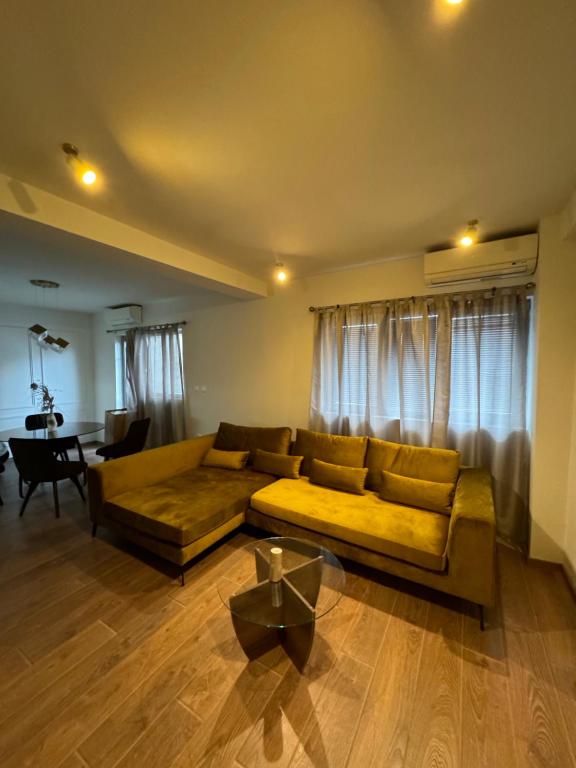 a living room with a couch and a table at Vodno Apartment Skopje in Skopje