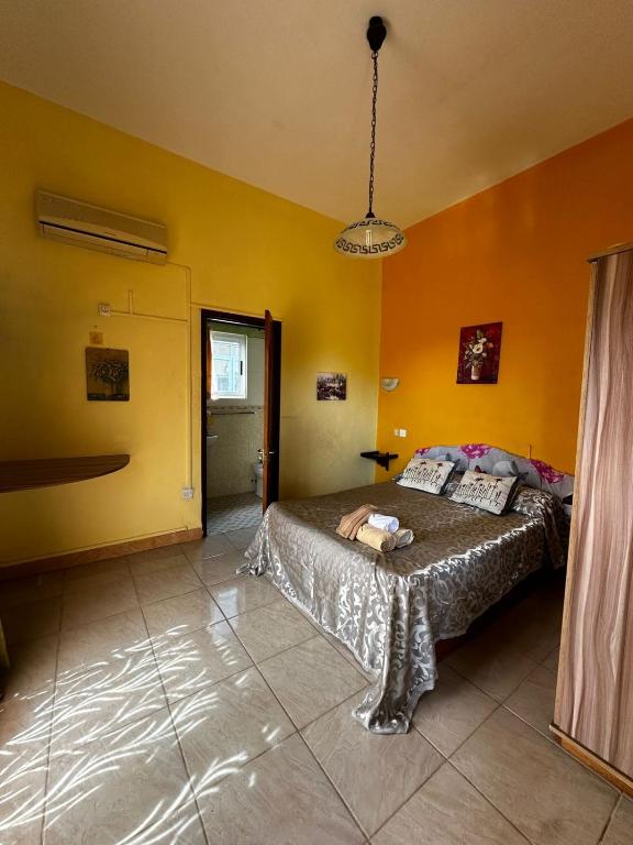 Postel nebo postele na pokoji v ubytování Sun & Earth Villa