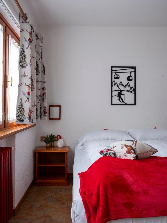 Postel nebo postele na pokoji v ubytování Residence Monterosa