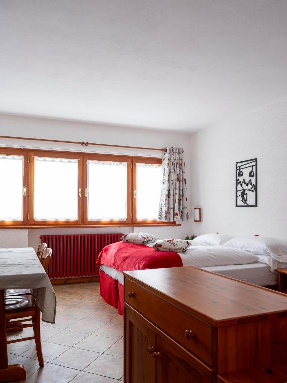 Postel nebo postele na pokoji v ubytování Residence Monterosa
