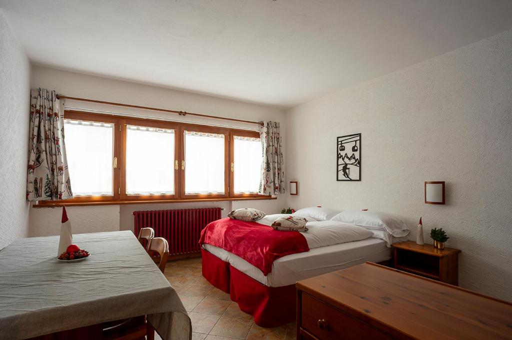 Postel nebo postele na pokoji v ubytování Residence Monterosa