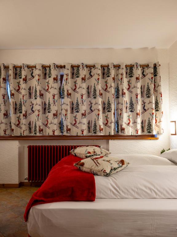 Postel nebo postele na pokoji v ubytování Residence Monterosa