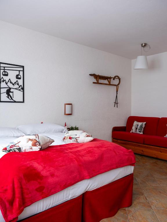 Postel nebo postele na pokoji v ubytování Residence Monterosa