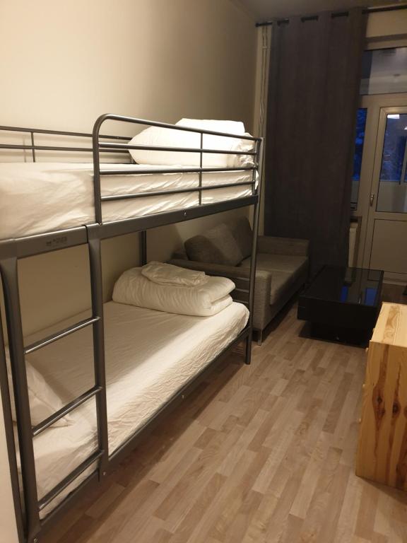 a couple of bunk beds in a room at The old school motell & lägenheter in Marma