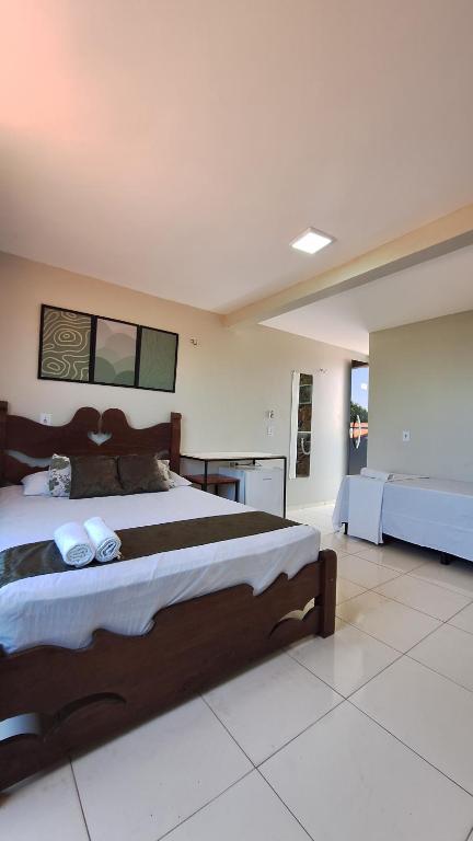 A bed or beds in a room at Canto da Duna Hotel
