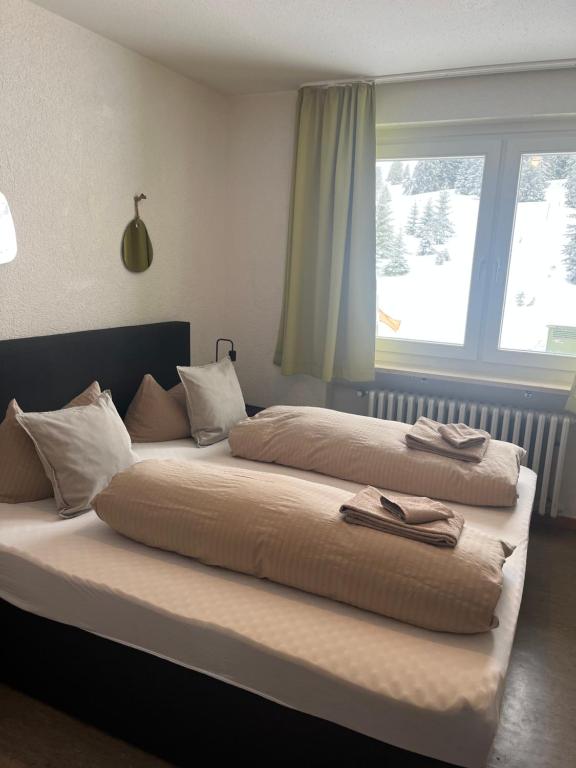 Postel nebo postele na pokoji v ubytování Berggasthof zur Todtnauer Hütte