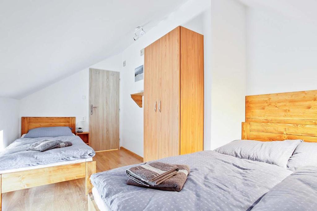 Postel nebo postele na pokoji v ubytování APARTMÁN U MAXÍKŮ