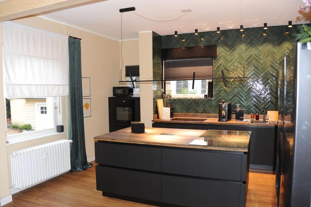 a kitchen with a counter top in a room at Luxuriöse Wohnung in Schwerte in Schwerte