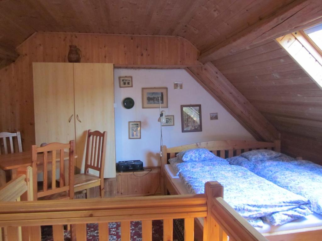 A bed or beds in a room at Bozsoki Pihenő
