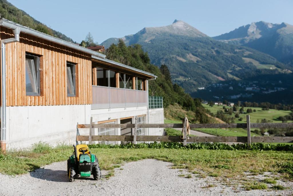 a small toy car parked next to a building at Tofererhof in Bad Hofgastein
