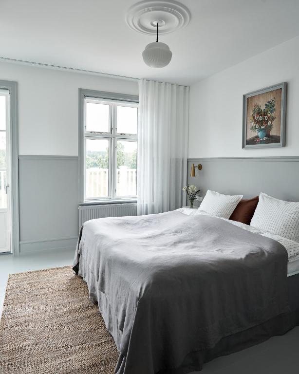 Postel nebo postele na pokoji v ubytování Hotel Ny Hattenæs