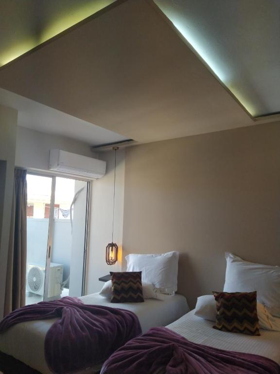 Postel nebo postele na pokoji v ubytování CENTRAL VIEW ΜΙΔΕΙΑ