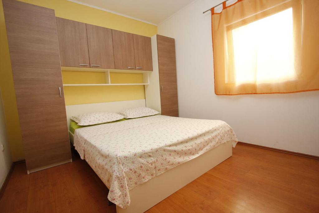 Postel nebo postele na pokoji v ubytování Apartments Lidus