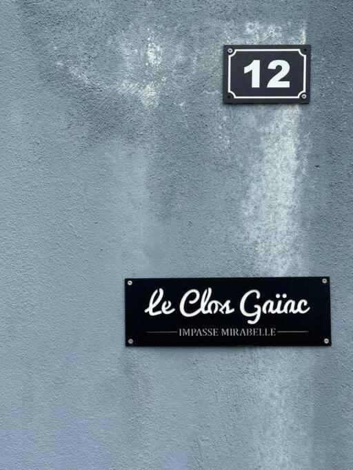 a sign on a wall that says la claus gamma at SLM - Le clos Gaïac - A in Saint-Laurent du Maroni
