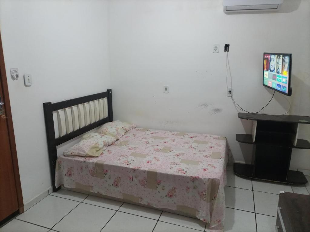 Postel nebo postele na pokoji v ubytování Casa em Guriri para temporada