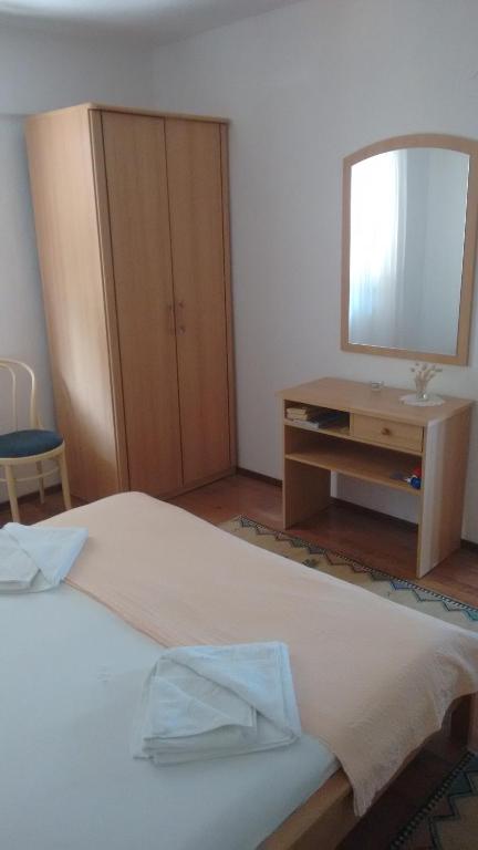 Postel nebo postele na pokoji v ubytování Apartments Vukas
