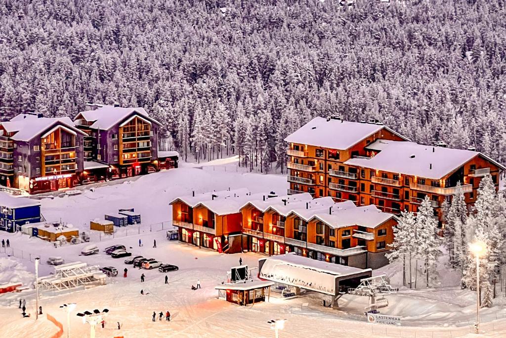 an aerial view of a resort in the snow at Chalet Auroras - Top quality 2 bdr chalet in prime location of Levi in Levi