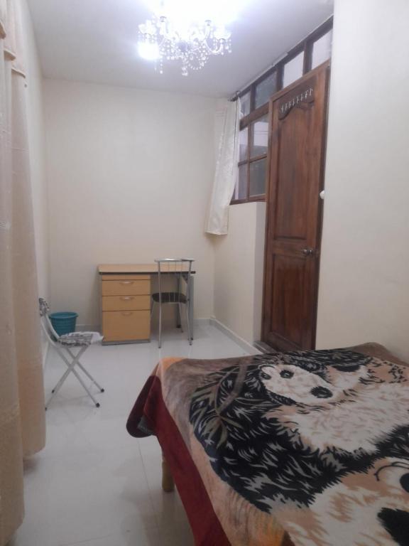 Postel nebo postele na pokoji v ubytování Hostal Atlantis