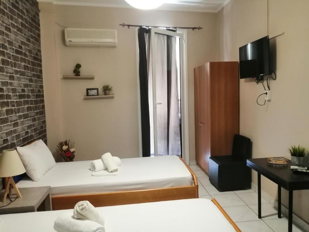 Postel nebo postele na pokoji v ubytování Hotel Efyra