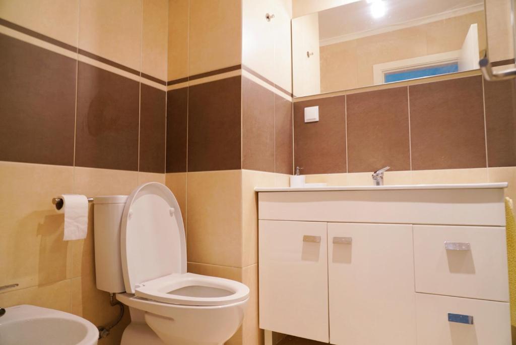 a bathroom with a toilet and a sink at Always on the way - Road Home in Montijo, Lisbon in Montijo