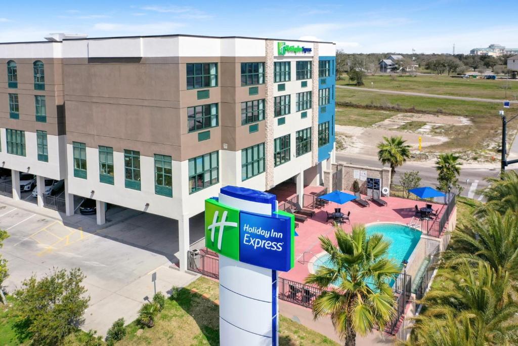 an image of the front of a hotel building at Holiday Inn Express - Gulfport Beach, an IHG Hotel in Gulfport