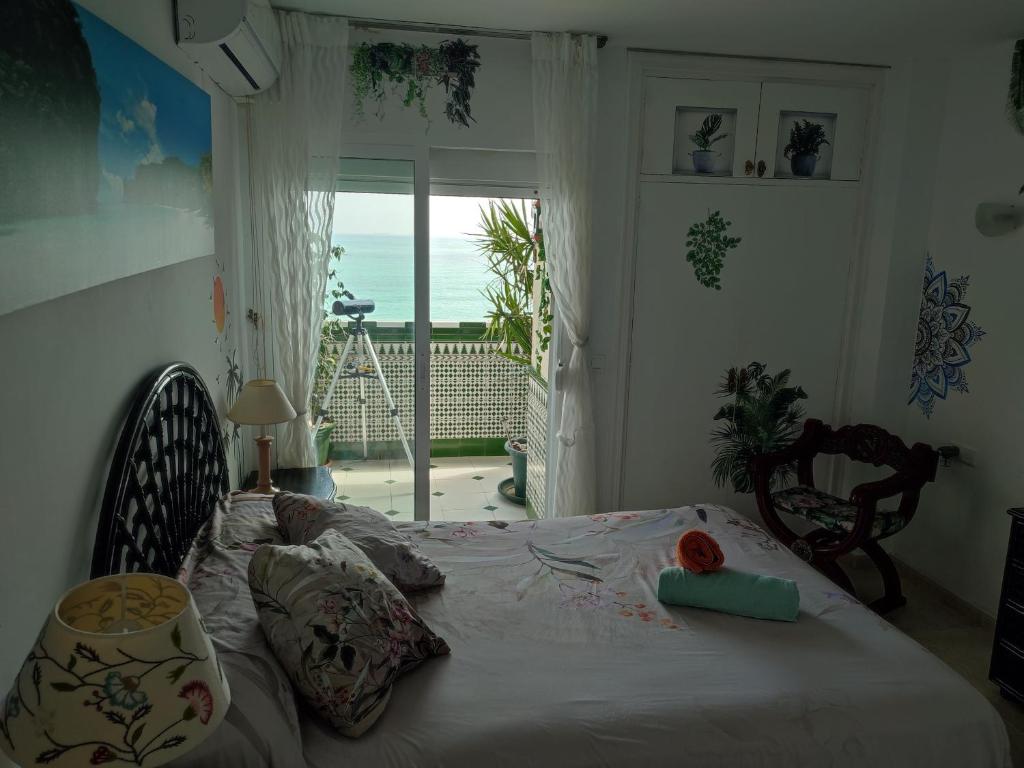 Posteľ alebo postele v izbe v ubytovaní Apartamento en Playa Semi-Privada