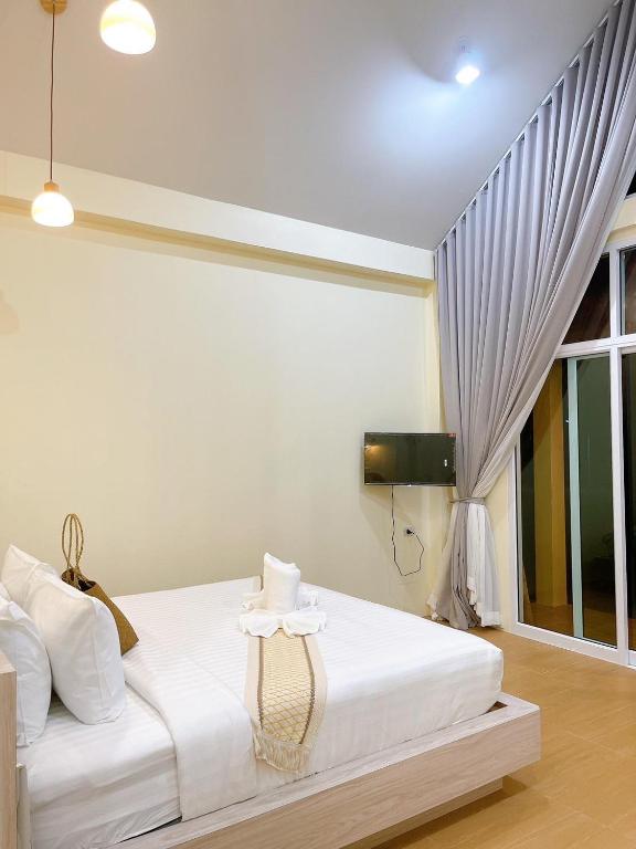 Postel nebo postele na pokoji v ubytování Chokdee Resort