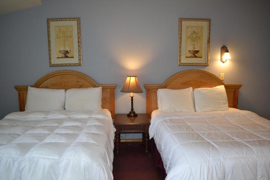 Postel nebo postele na pokoji v ubytování Anaco Bay Inn