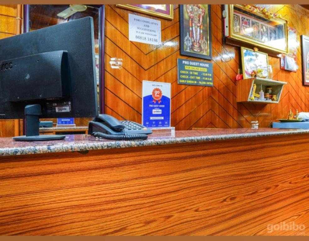 a store counter with a phone on top of it at PMS INN in Puducherry
