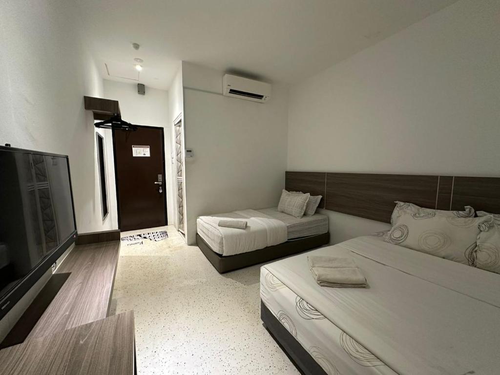 Postel nebo postele na pokoji v ubytování WF Motel