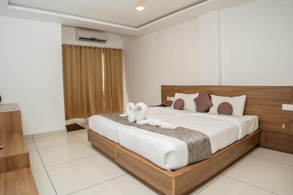 Postel nebo postele na pokoji v ubytování HOTEL LETS STAY