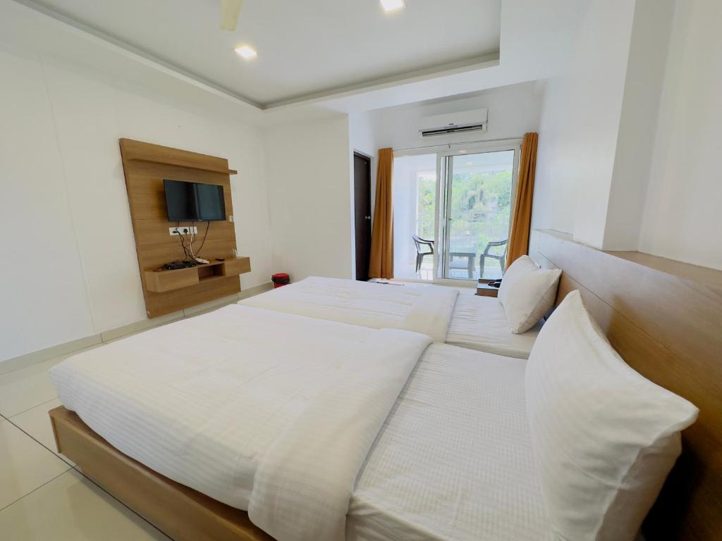 Postel nebo postele na pokoji v ubytování HOTEL LETS STAY