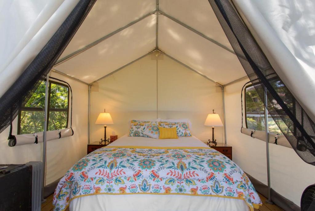 a bedroom with a bed in a tent at Beautiful cozy tent in Catskill in Catskill