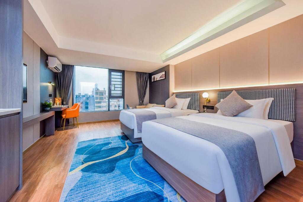 Postel nebo postele na pokoji v ubytování Shangpin Holiday Inn - Guangzhou New Baiyun International Airport Flagship Store