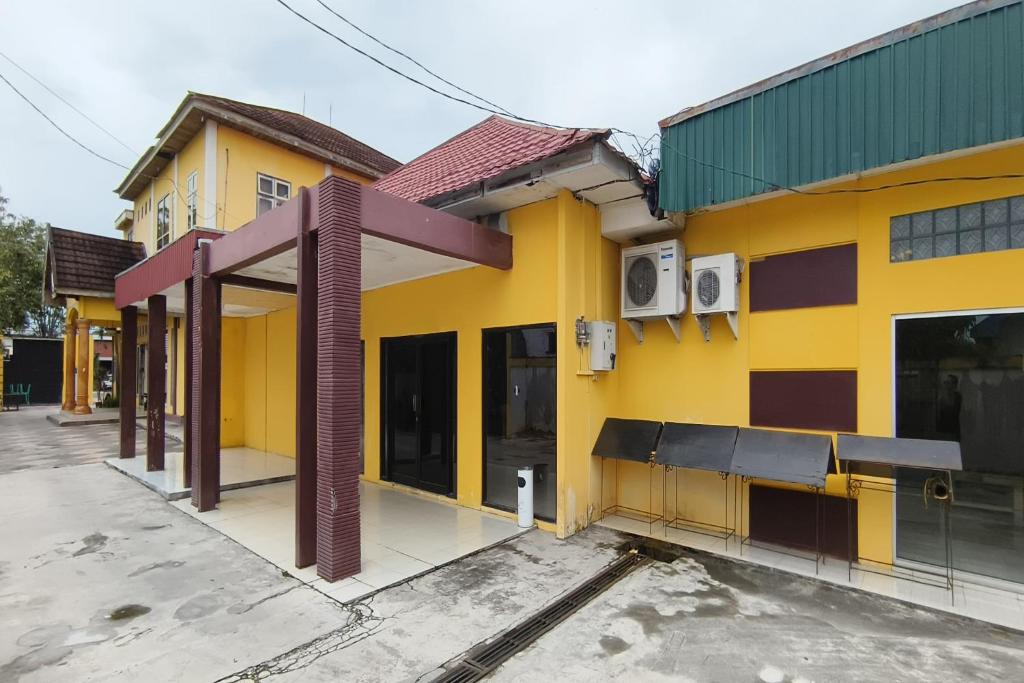 OYO 93521 Wisma Flamboyan - Housity