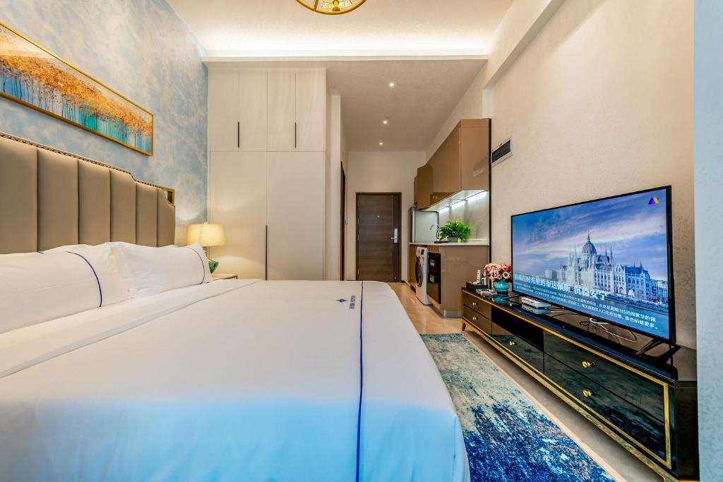 TV a/nebo společenská místnost v ubytování BORUISI Plaza Residence Apartment - Shenzhen Futian Convention & Exhibition Center