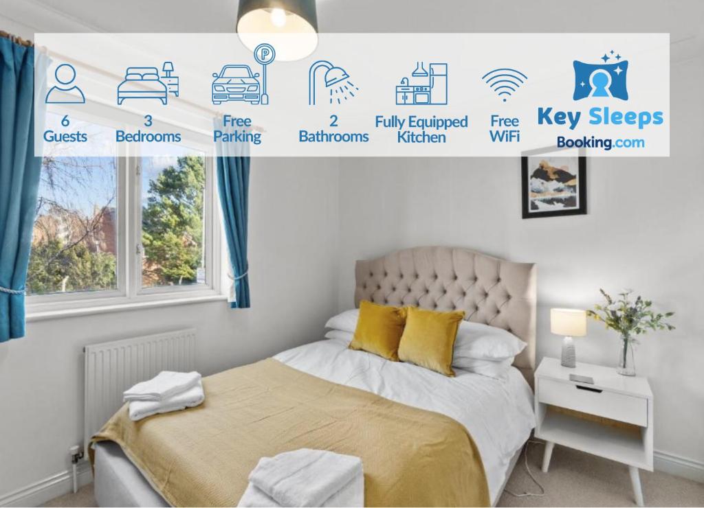 a bedroom with a bed and a poster of different rooms at Free Parking Near Shelly Beach Holiday Home in Exeter