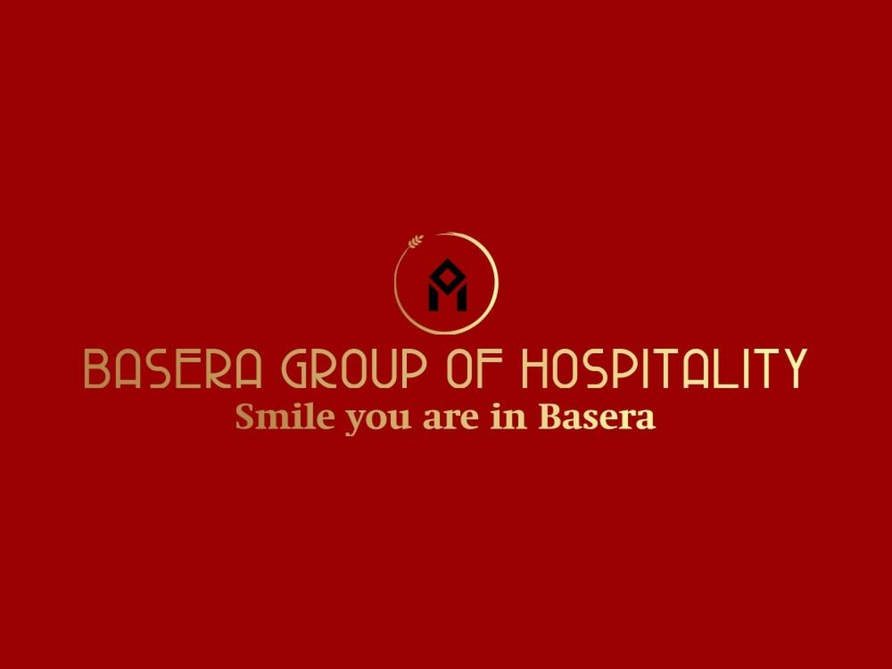 a red background with a sign that reads bacer group of hospitals smile you are at BASERA HOSTEL DORMITORY in Alambagh