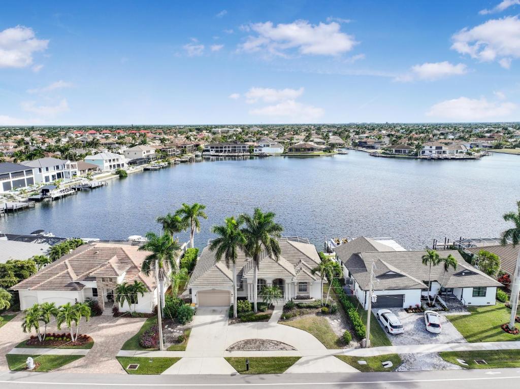an aerial view of a large body of water with houses at Waterfront home with views, pool and walk to beach in Marco Island