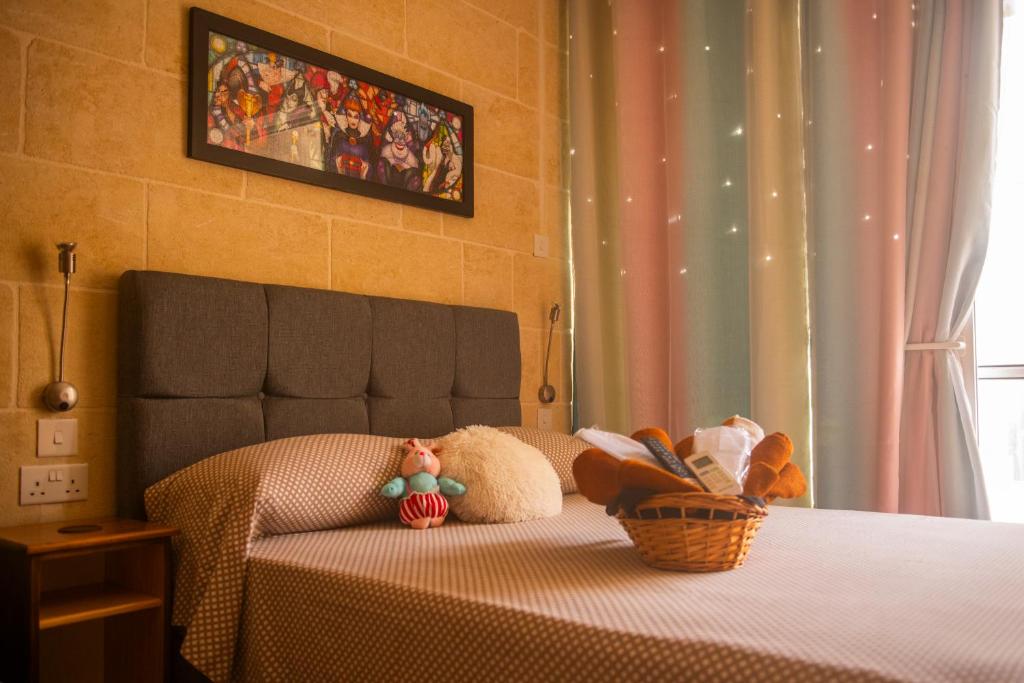 Postel nebo postele na pokoji v ubytování Ta Naqċil