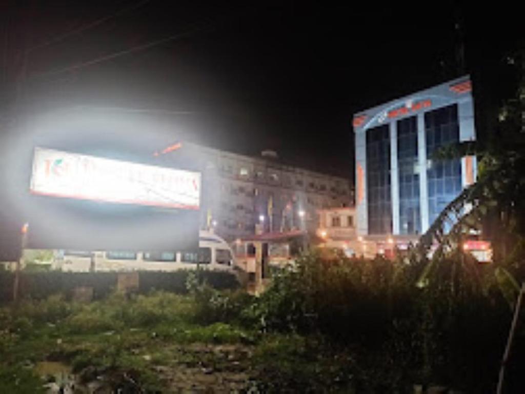 a view of a city at night with buildings at Hotel Shiva , Bodh Gaya in Bodh Gaya