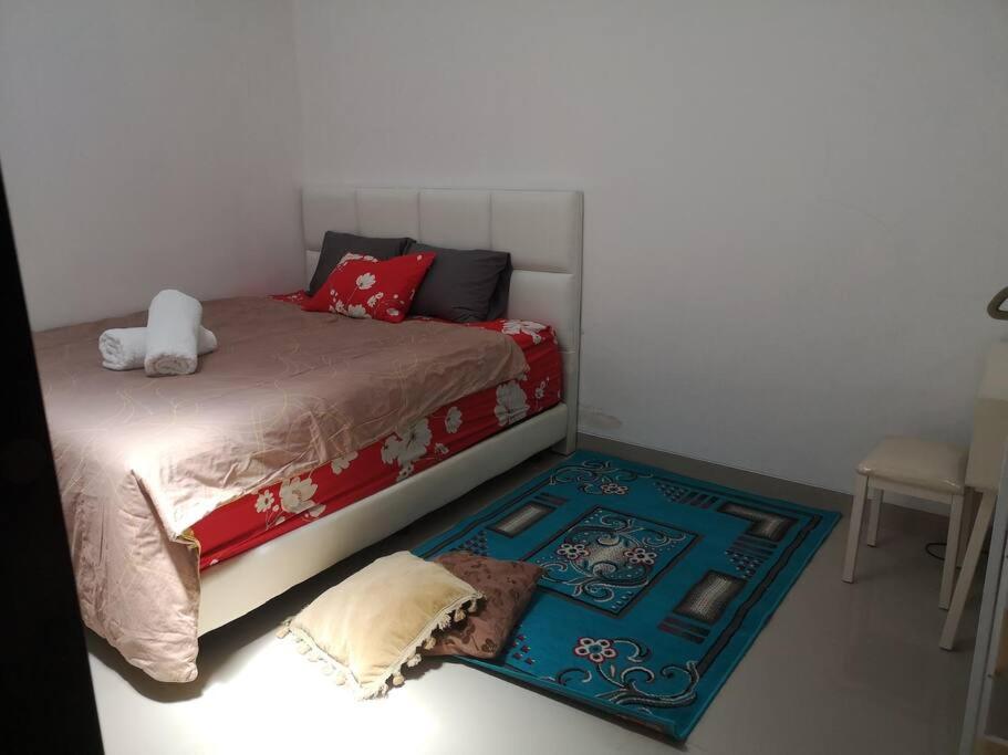 Posteľ alebo postele v izbe v ubytovaní EarlyHome@Adena- Graha Raya