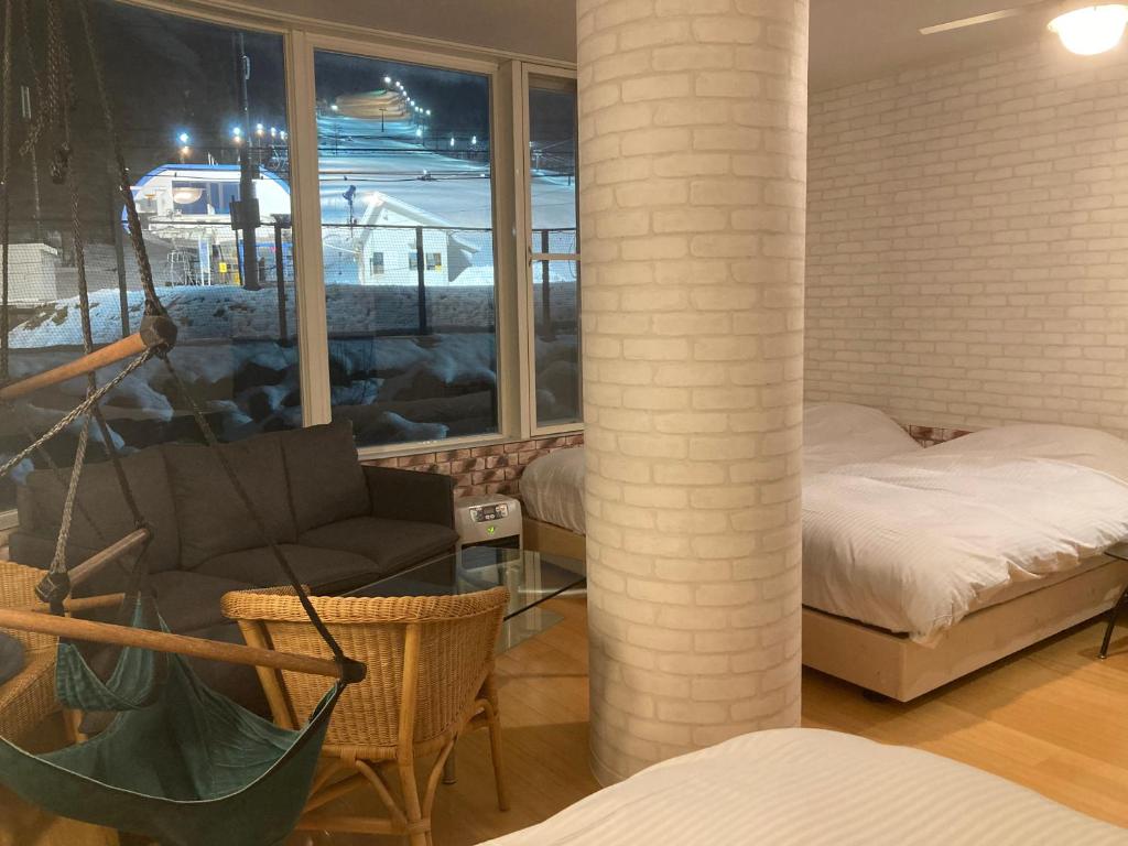 Postel nebo postele na pokoji v ubytování Lift Inn Hakuba Goryu