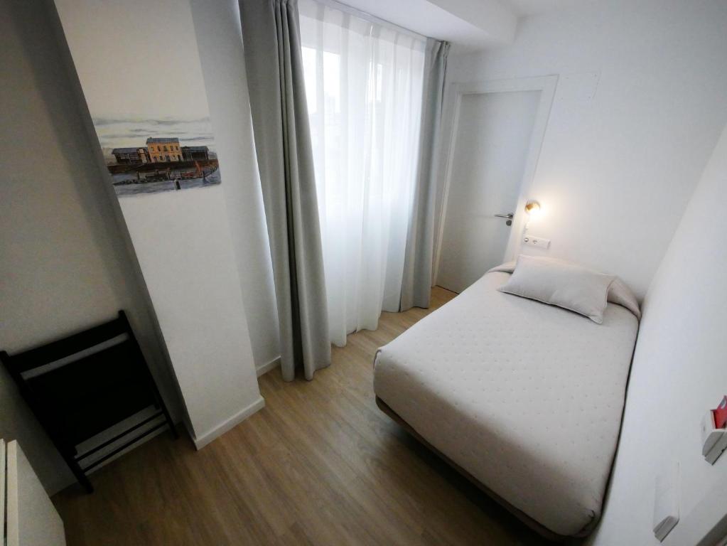 Postel nebo postele na pokoji v ubytování Hotel Myro