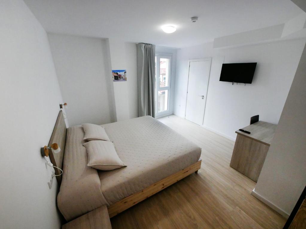 Postel nebo postele na pokoji v ubytování Hotel Myro