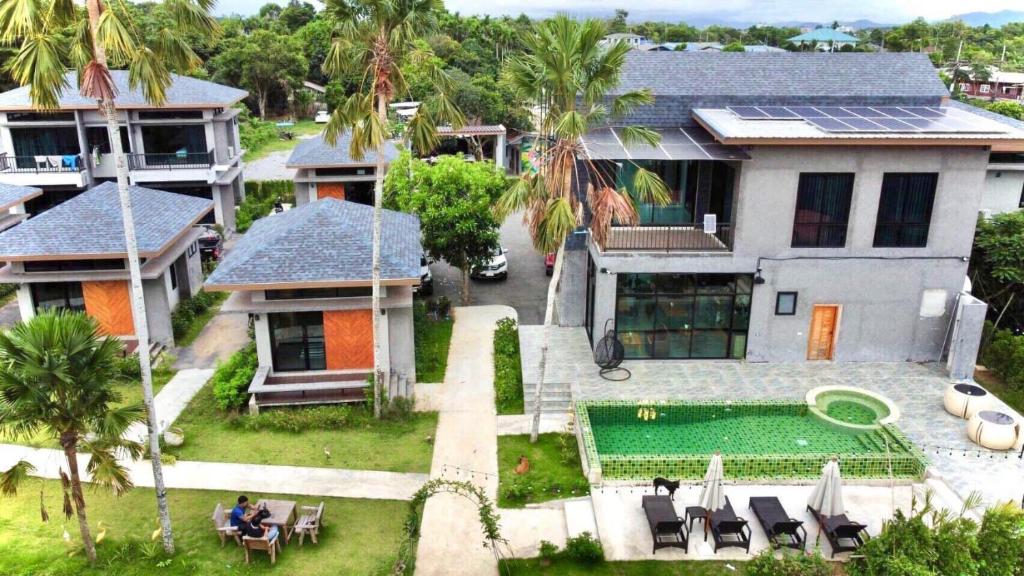 an aerial view of a house with a swimming pool at ProudChan Boutique Resort in Chanthaburi