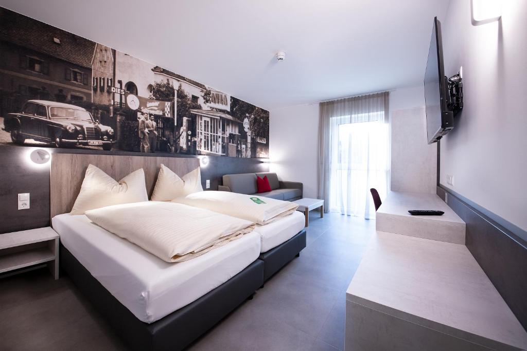 Postel nebo postele na pokoji v ubytování FairSleep AVIA Motel Zwettl