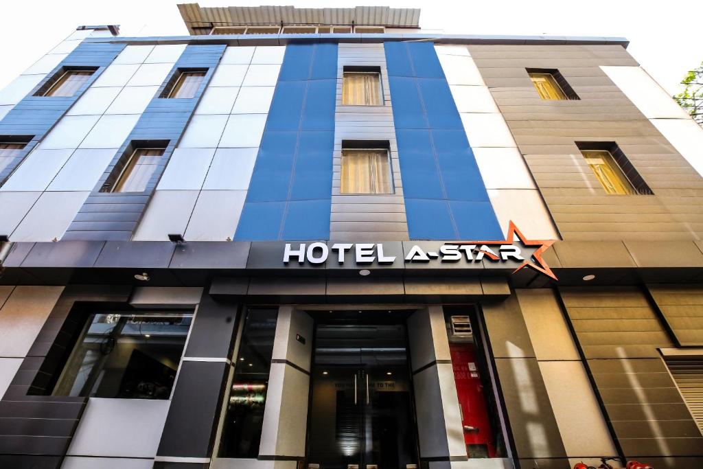 a hotel a star sign on the front of a building at Hotel A Star - 50 Meter From Golden Temple in Amritsar