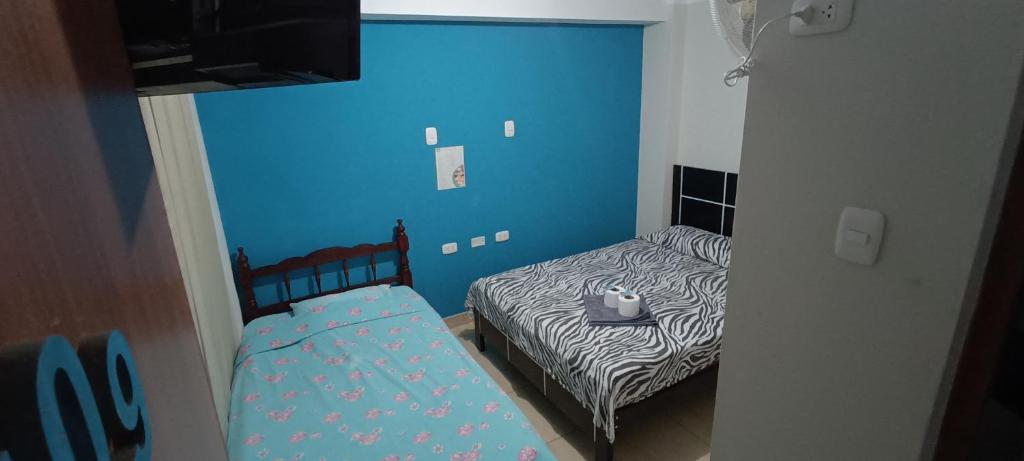 Postel nebo postele na pokoji v ubytování AYPA Hostal