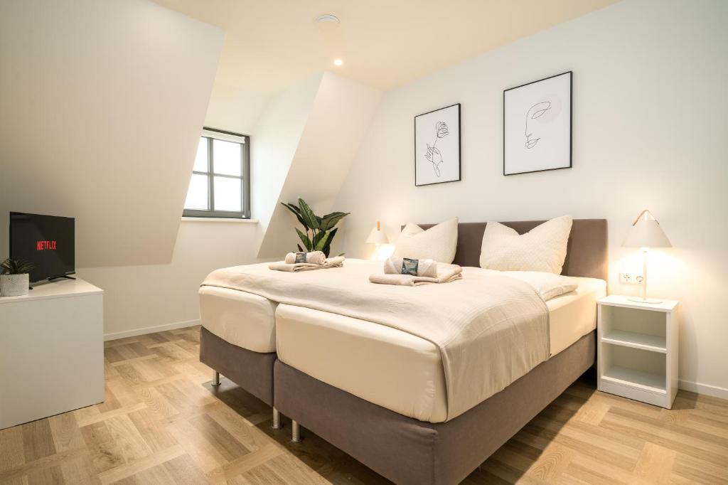 מיטה או מיטות בחדר ב-Zolima - Apartment - Familie - Paare - E-Bike Ladestation